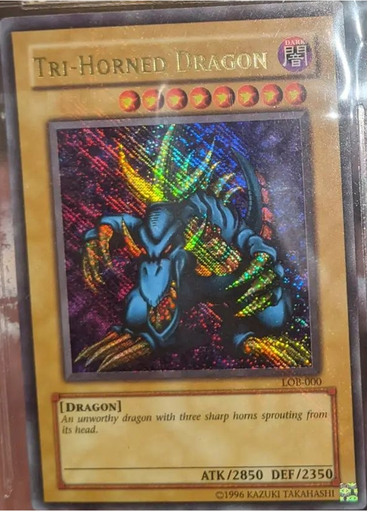 Tri-Horned Dragon (Secret Ultra Rare Unlimited Reverse Foil Pattern)